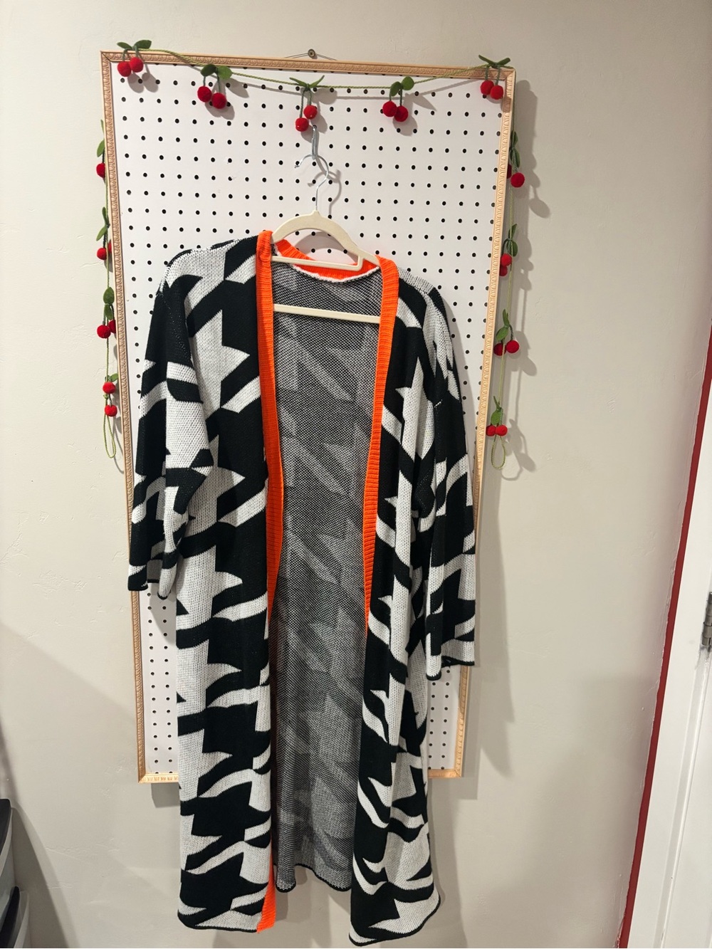 Houndstooth cardigan with orange trim